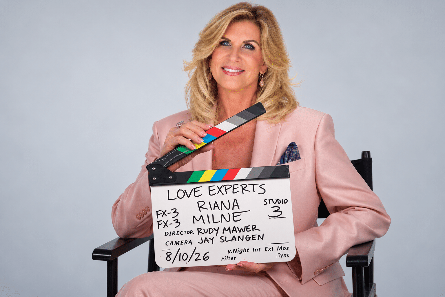 Riana Milne holding the Love Experts production slate